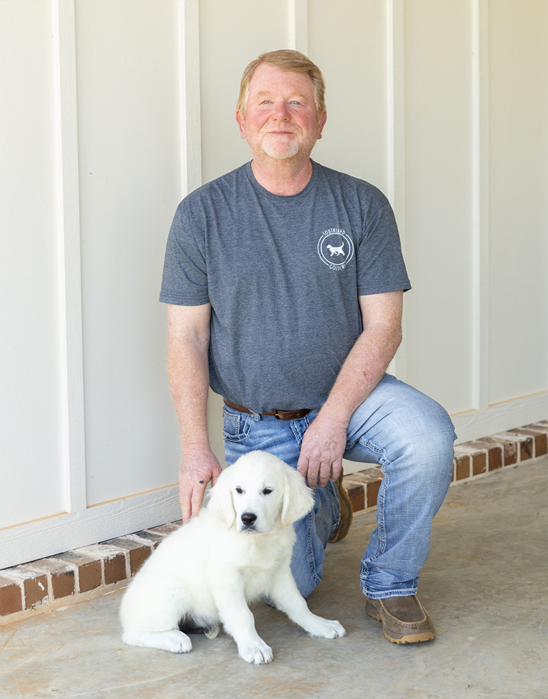 a man holding a dog