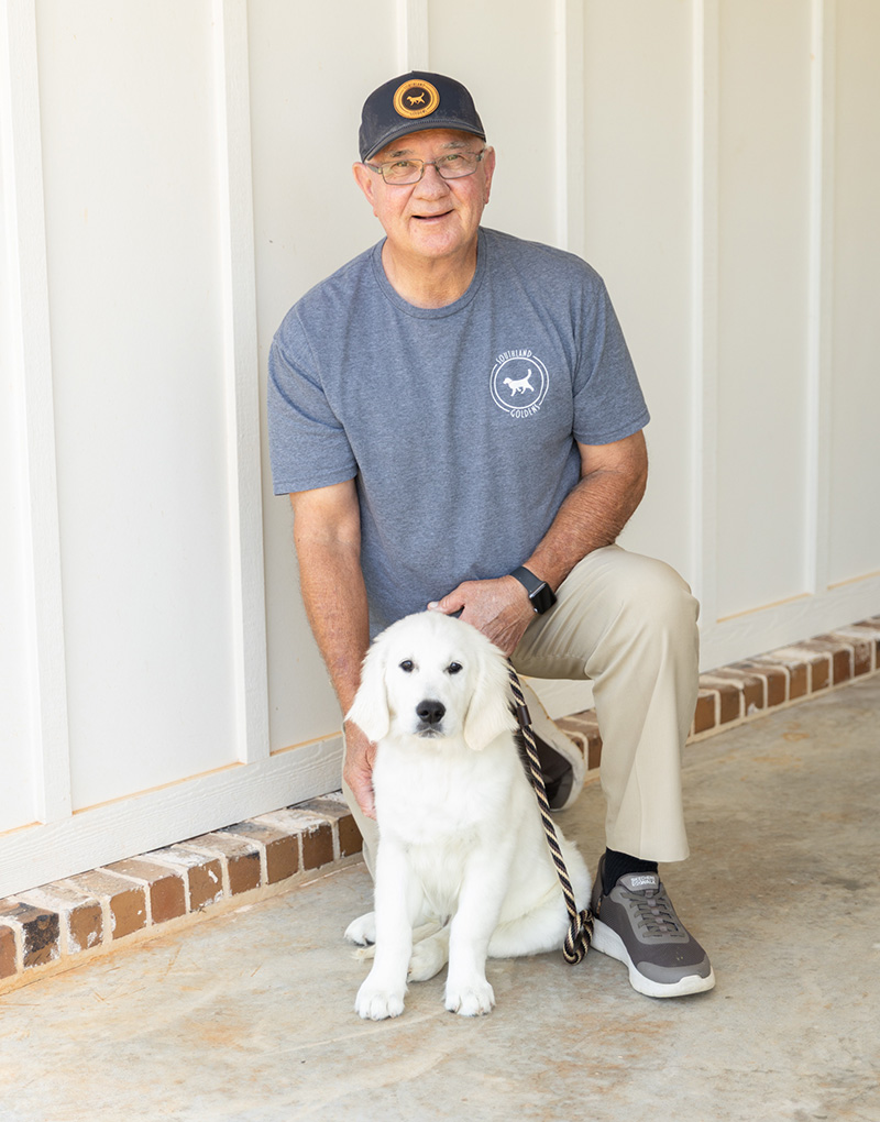 a man holding a dog
